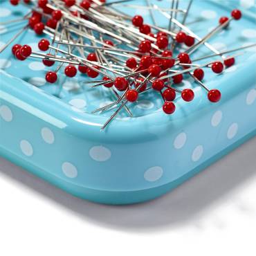 Magnetic pincushion with glass-headed pins